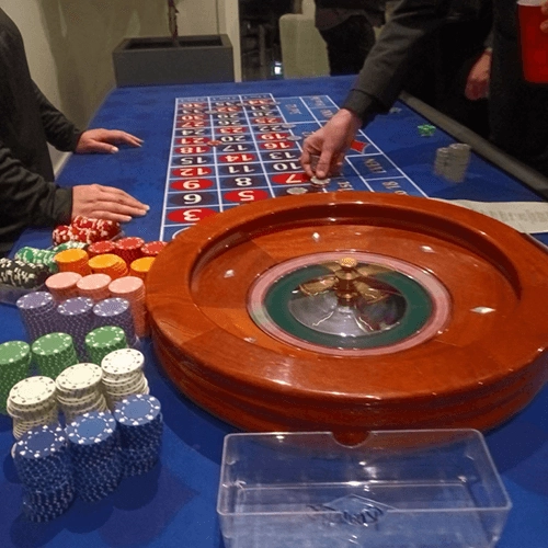 Professional wooden roulette wheel set on a table.